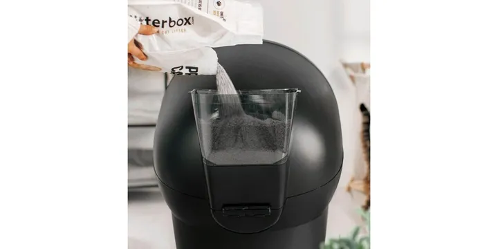 Litter-Robot 4 with the LitterHopper accessory being refilled, official Whisker product photo of the $129 add-on that tops up litter automatically